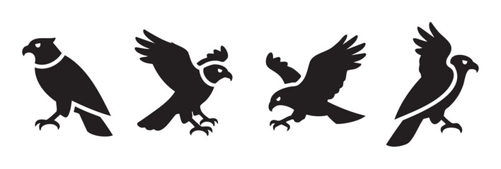 Obraz premium Four stylized birds of prey icons in various dynamic poses, depicting majestic raptors with powerful wings and sharp talons, symbolizing strength and freedom.