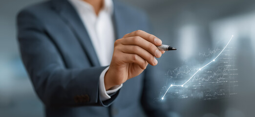 Businessman drawing rising financial graph with digital data growth analytics and corporate investment strategy concept
