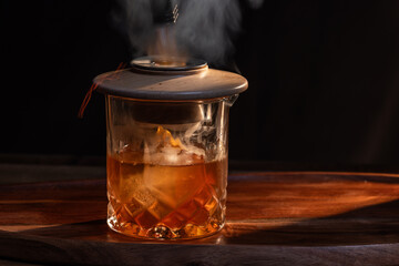 Aromatic smoke added to the top of an Old Fashioned Cocktail