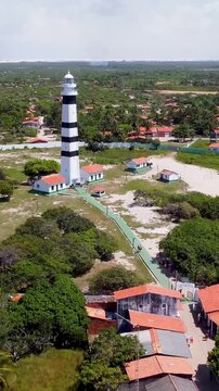 Mandacaru Lighthouse At Barreirinhas Maranhao Brazil. Birds Eye View Of Lighthouse Standing Tall Against The Blue Sky. Coast Clouds Seaside Summertime. Coast Outdoor Panorama. Barreirinhas Maranhao.