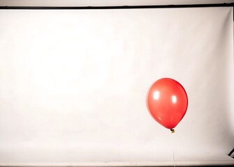 Red Balloon On White Background With Copy Space