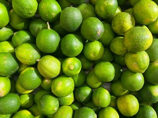 View from above of fresh limes in the market