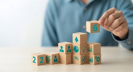 Illustration of businessman stacking wooden blocks with icons and numbers to build a growing chart or structure representing business success and goal achievement
