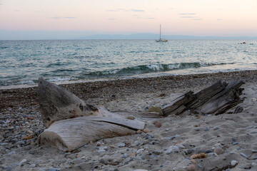 The beach is empty and the sea is calm