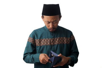 Sad young Asian Muslim man holding an empty wallet with a confused expression, showing financial difficulty during Ramadan before Eid Mubarak. Isolated on a white background.