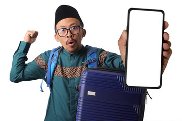 Shocked Asian Muslim man with a backpack and a suitcase, showing a phone with a blank white screen to the camera with a surprised expression, ready for mudik tradition, Isolated on a white background