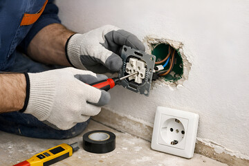 Electrician Repairing Outlet: Electrical Work, Installation