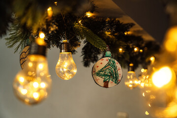Handmade Christmas tree ornament with warm fairy lights. High quality photo