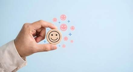 hand holding smiley face with various emoticons