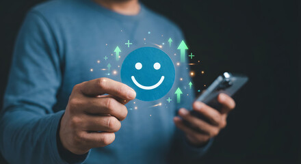 Man holding smartphone with happy smiley face and growth symbols