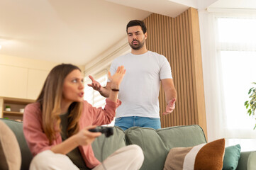 Couple arguing over video game addiction causing relationship conflict