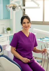 Elderly Spanish female dentist in a dental clinic