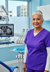 Elderly Latinx female dentist in a dental clinic