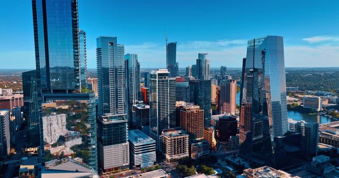 Glass and concrete skyscrapers in the dense urban landscape of modern city. Drone flight in downtown Houston, Texas, USA.