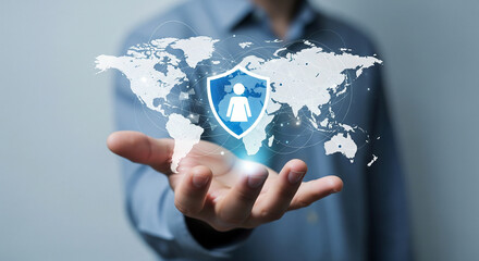 Global protection and security concept with a hand holding a shield and world map.