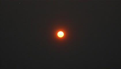The moon in its waxing phase against a dark sky, with the sun's crescent visible just above the horizon.
