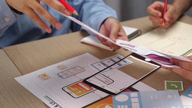 Panorama video of startup company employee planning on user interface prototype for mobile application or website in office. UX UI designer brainstorm designing user friendly interface plan. Synergic