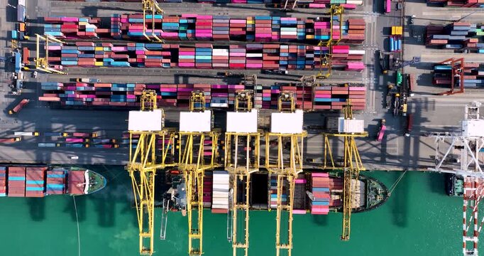 Shipping Port Aerial Top Down View Container Ship Docked Quay. Gantry Cranes Loading Unloading Cargo Containers. Global Logistics Supply Chain Import Export Terminal Operation.