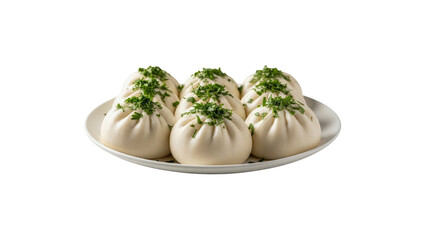 Khinkali dumplings with parsley on a white plate