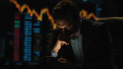 Investor Checking Stock Data on Phone