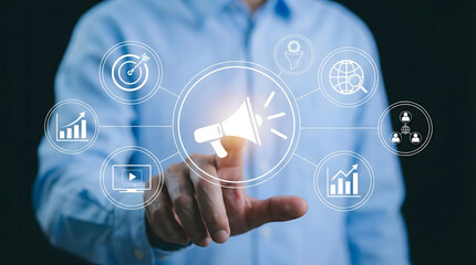 Businessman touching virtual megaphone icon,concept of digital marketing,advertising strategy,public relations,social media promotion,brand awareness and customer targeting.