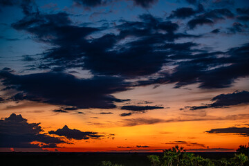 Dramatic sunset sky with dark storm clouds over Florida landscape