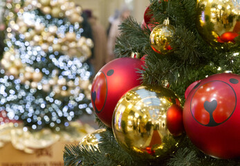 New Year's Eve decoration of street. Christmas trees with balls on branches.