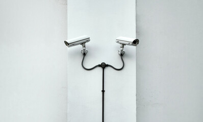 Two Security Cameras on White Gray Wall Background Outside, CCTV Cameras for Surveillance Safety