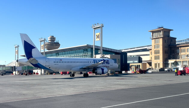 Flyone armenia airplane parked at zvartnots international airport tarmac