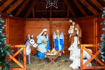 SPYTKOWICE, POLAND - DECEMBER 23, 2025: Traditional Christmas decorations, nativity scene by the church in Spytkowice, Poland.