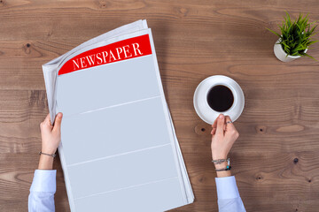 newspaper and coffee on office table