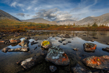 Misty Mountain Lake Landscape With Mossy Rocks, Autumn Colors, And Reflections