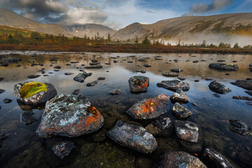 Misty Mountain Lake Landscape With Mossy Rocks, Autumn Colors, And Reflections