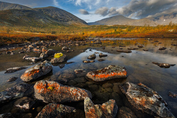 Misty Mountain Lake Landscape With Mossy Rocks, Autumn Colors, And Reflections