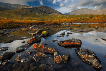 Misty Mountain Lake Landscape With Mossy Rocks, Autumn Colors, And Reflections