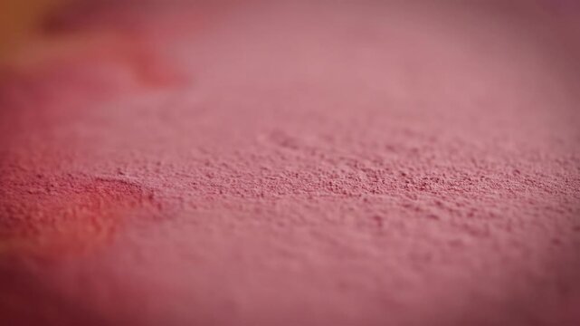 A serene landscape with soft pink sand texture in a close-up view