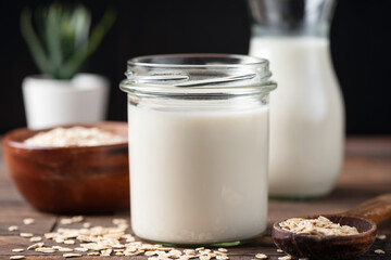 Healthy vegan dairy free lactose free oat milk in a glass jar