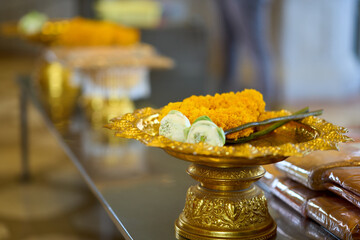 Bangkok, Thailand - 24th December 2025: Flower offering at Wat Trai Mit