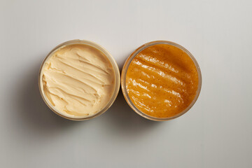 Yellow body butter and skin scrub close-up