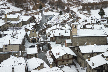 Aerial view of Chianale during winter season, a typical alpine village in Piedmont region, Italy