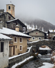 View of Chianale, a typical alpine village covered with snow during winter, Piedmont region, Italy