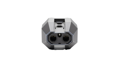A sleek metallic futuristic adapter with dual hexagonal power sockets is prominently displayed against a pure black background.