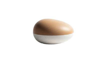 A unique two-toned object resembling an egg or capsule with a textured bottom half on a black background.