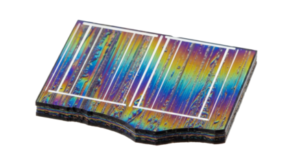 A colorful iridescent microchip or circuit board displays a vibrant spectrum of reflected light.