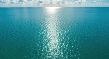 Ocean expanse with sunlight reflections on the water surface