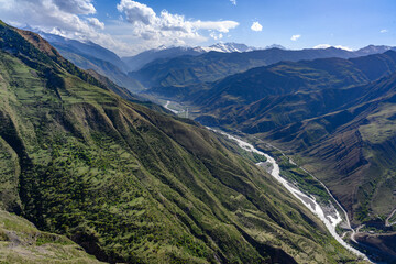 Fototapeta premium Aerial View of a Serene Mountain Valley and River