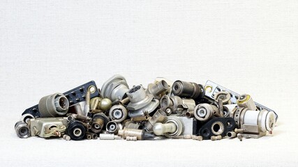 A pile of old ,worn-out silver -plated connectors,toggle switches ,contacts,and selectors.A ligature composed of radio components.