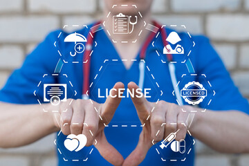 Doctor using virtual touch screen presses the word LICENSE. Health care license concept. Licensing pharmaceutical product, medical service, doctor, nurse.