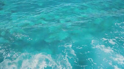 Video A surfer rides on top of a massive ocean wave, capturing the thrill and excitement of this outdoor adventure