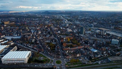 Obraz premium Aerial around the city Charleroi in Belgium on a cloudy afternoon in later fall.